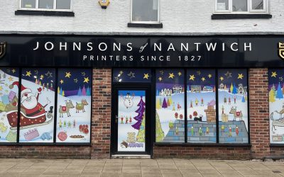 Johnsons in Nantwich installs Christmas window graphics with help from Contra Vision